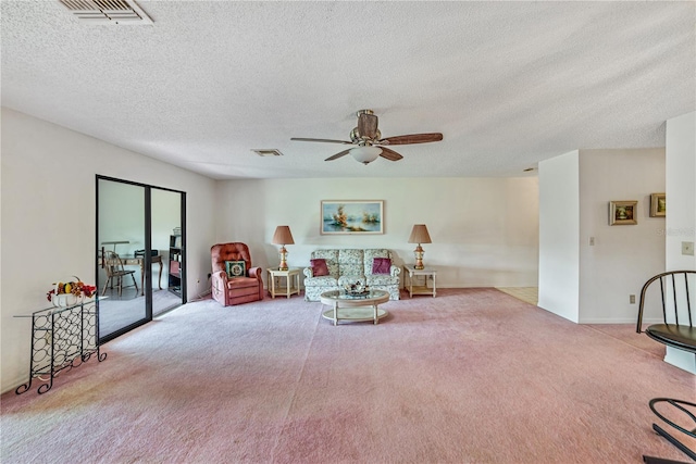 2607 Lancaster Dr Unit 35, Sun City Center, FL 33573 - sitting room featuring carpet flooring, ceiling fan, and a textured ceiling