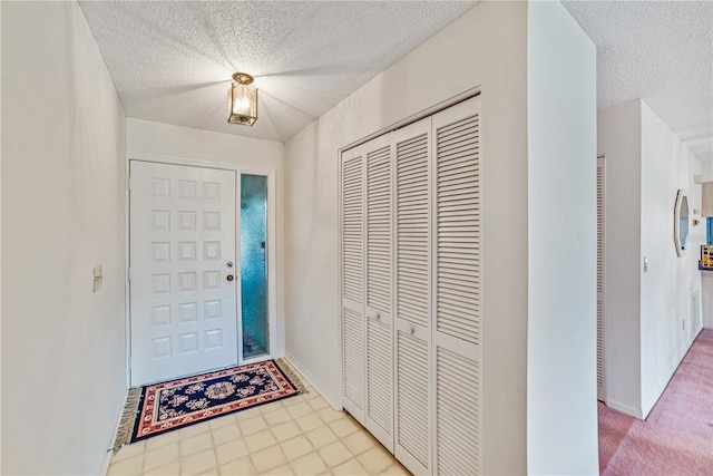2607 Lancaster Dr Unit 35, Sun City Center, FL 33573 - foyer entrance featuring a textured ceiling and baseboards