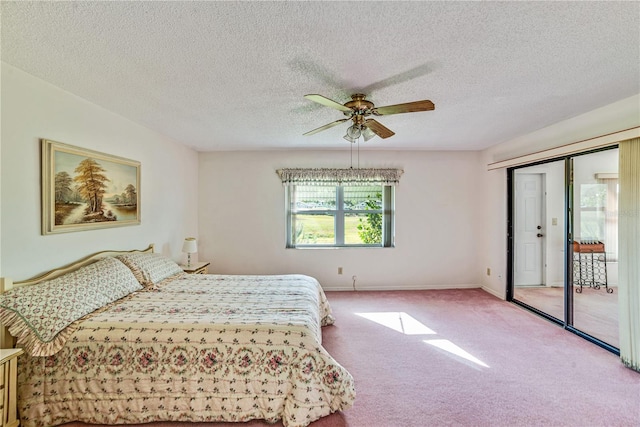 2607 Lancaster Dr Unit 35, Sun City Center, FL 33573 - bedroom featuring carpet, a textured ceiling, ceiling fan, and baseboards
