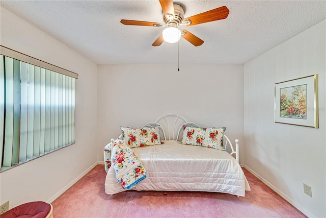 2607 Lancaster Dr Unit 35, Sun City Center, FL 33573 - bedroom with carpet, a textured ceiling, baseboards, and ceiling fan