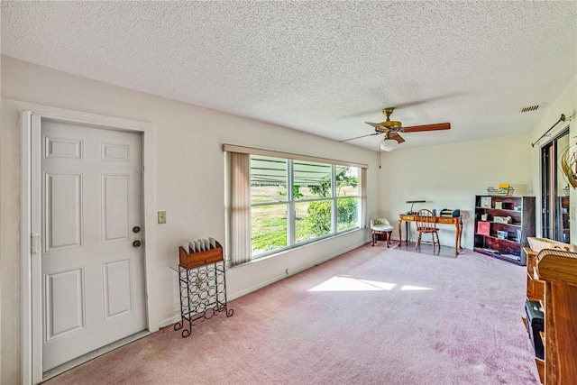 2607 Lancaster Dr Unit 35, Sun City Center, FL 33573 - interior space with carpet, a ceiling fan, and a textured ceiling