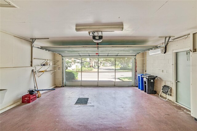 2607 Lancaster Dr Unit 35, Sun City Center, FL 33573 - garage featuring a garage door opener