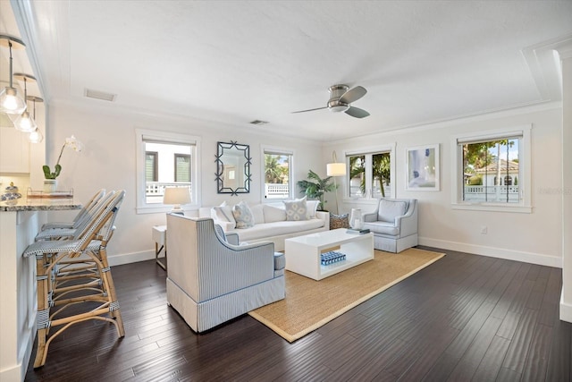 1841 Datura St, Sarasota, FL 34239 - living room with ceiling fan, plenty of natural light, baseboards, and crown molding