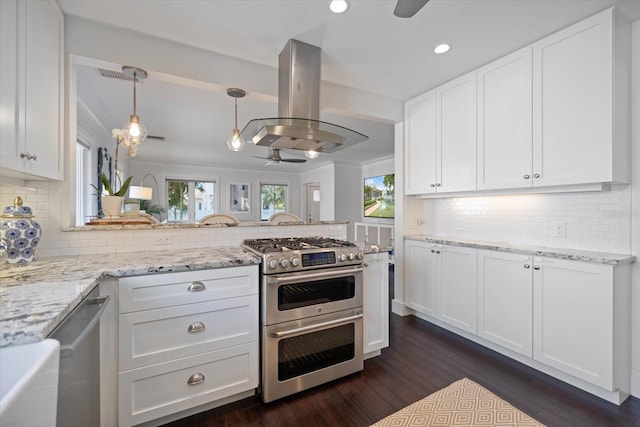 1841 Datura St, Sarasota, FL 34239 - kitchen featuring appliances with stainless steel finishes, island exhaust hood, a ceiling fan, dark wood finished floors, and white cabinetry