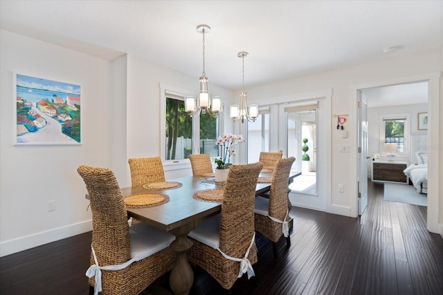 1841 Datura St, Sarasota, FL 34239 - dining room featuring a chandelier, baseboards, and dark wood-type flooring