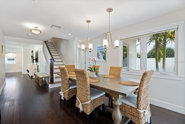 1841 Datura St, Sarasota, FL 34239 - dining area featuring baseboards, a chandelier, dark wood-style floors, stairs, and recessed lighting