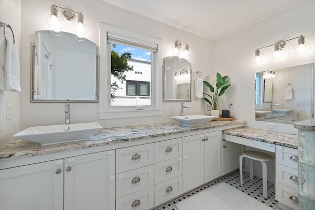 1841 Datura St, Sarasota, FL 34239 - bathroom featuring double vanity and tile patterned floors