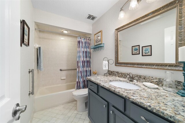 bathroom featuring tile patterned floors, toilet, vanity, shower / tub combo with curtain, and a textured ceiling