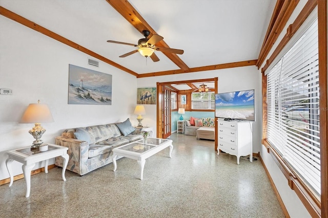 living room featuring ceiling fan, baseboards, and speckled floor