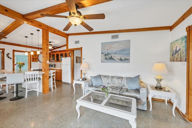 living area with a ceiling fan, beam ceiling, and speckled floor