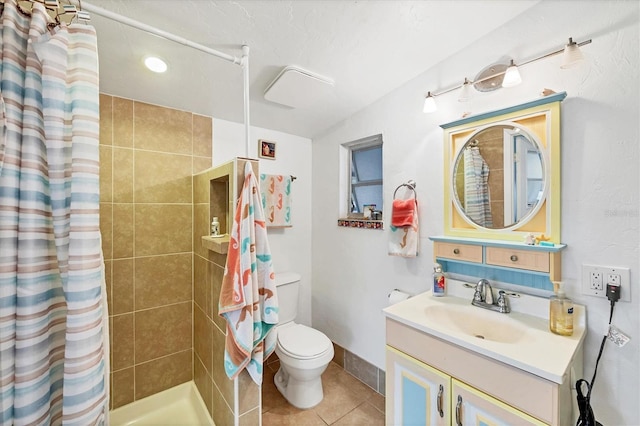full bathroom with a tile shower, toilet, vanity, and tile patterned flooring