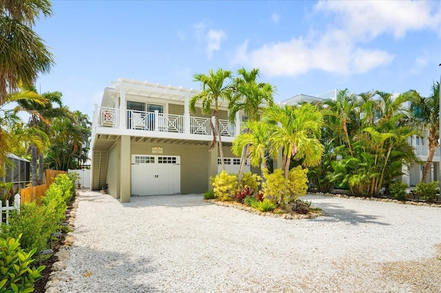 229 S Harbor Dr, Holmes Beach, FL 34217 - beach home featuring an attached garage, driveway, and stucco siding