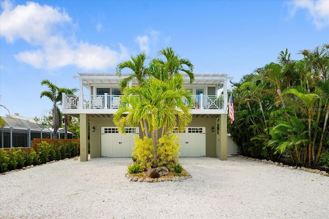 229 S Harbor Dr, Holmes Beach, FL 34217 - beach home with driveway, a garage, and stucco siding