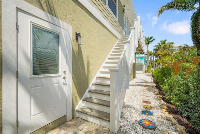 229 S Harbor Dr, Holmes Beach, FL 34217 - doorway to property featuring stucco siding