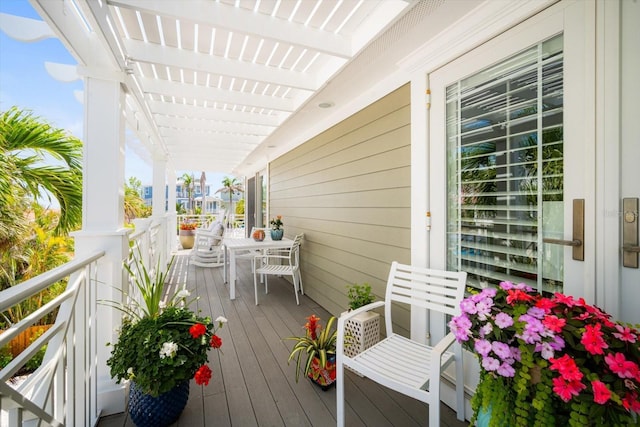 229 S Harbor Dr, Holmes Beach, FL 34217 - wooden terrace with outdoor dining space and a pergola