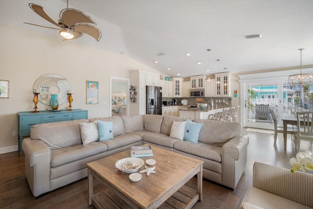 229 S Harbor Dr, Holmes Beach, FL 34217 - living room featuring vaulted ceiling, wood finished floors, recessed lighting, a chandelier, and a ceiling fan