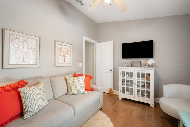 229 S Harbor Dr, Holmes Beach, FL 34217 - living area with wood finished floors, ceiling fan, and baseboards