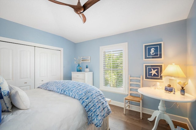 229 S Harbor Dr, Holmes Beach, FL 34217 - bedroom with wood finished floors, a closet, baseboards, and ceiling fan