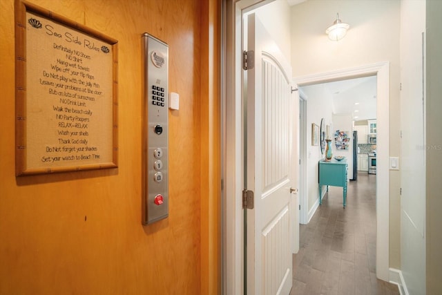 229 S Harbor Dr, Holmes Beach, FL 34217 - hallway with wood finished floors and baseboards
