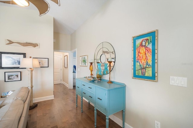 229 S Harbor Dr, Holmes Beach, FL 34217 - corridor with wood finished floors, baseboards, and high vaulted ceiling