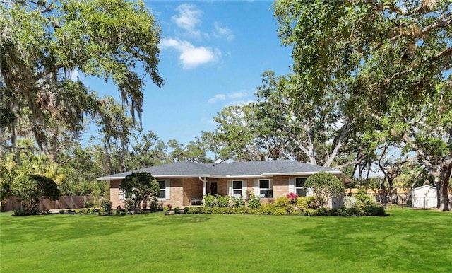 ranch-style house featuring brick siding