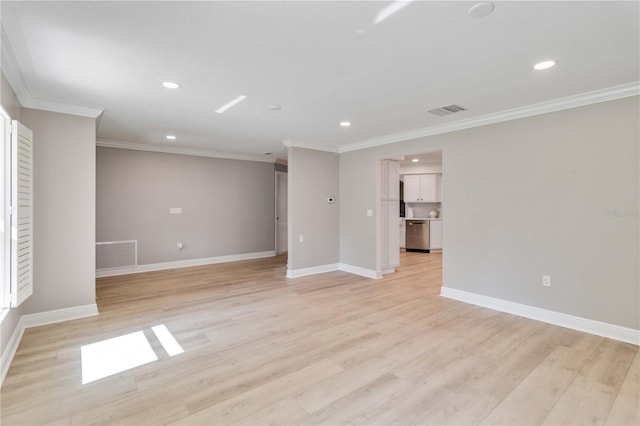 spare room with recessed lighting, light wood-style flooring, baseboards, and crown molding