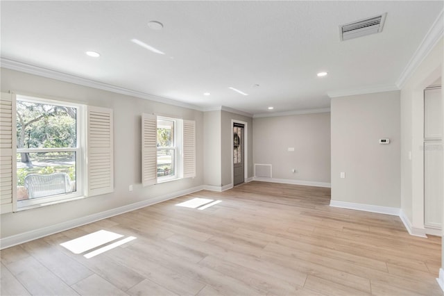 spare room with plenty of natural light, light wood-style flooring, recessed lighting, and ornamental molding