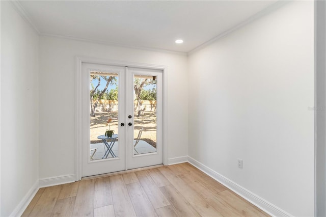 doorway to outside with light wood finished floors, ornamental molding, baseboards, french doors, and recessed lighting