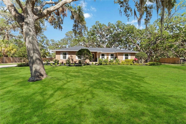 ranch-style home featuring brick siding