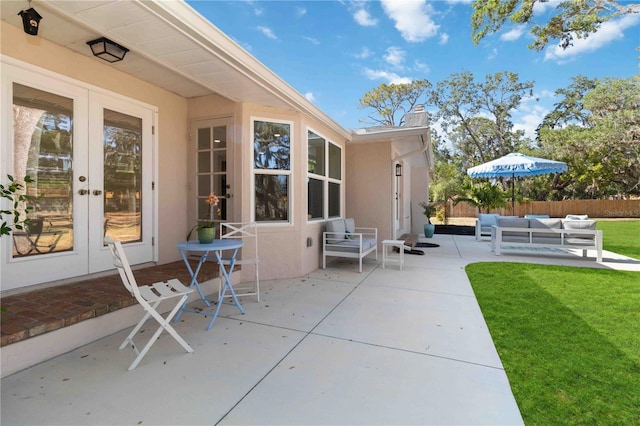 view of patio featuring french doors and an outdoor living space