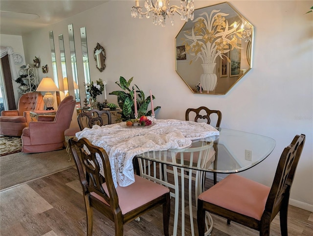5895 17th St W Unit B-26, Bradenton, FL 34207 - dining area featuring a chandelier and wood finished floors