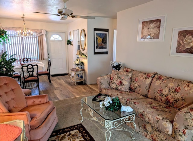 5895 17th St W Unit B-26, Bradenton, FL 34207 - living room featuring a chandelier, wood finished floors, and a ceiling fan