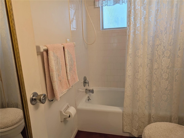5895 17th St W Unit B-26, Bradenton, FL 34207 - bathroom featuring toilet and shower / tub combo with curtain