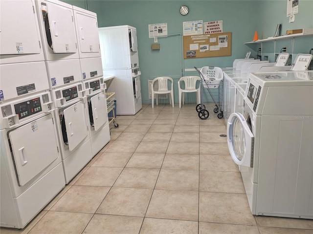 5895 17th St W Unit B-26, Bradenton, FL 34207 - shared laundry room featuring stacked washing machine and dryer, washing machine and clothes dryer, and light tile patterned flooring