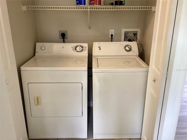 washroom with washing machine and clothes dryer