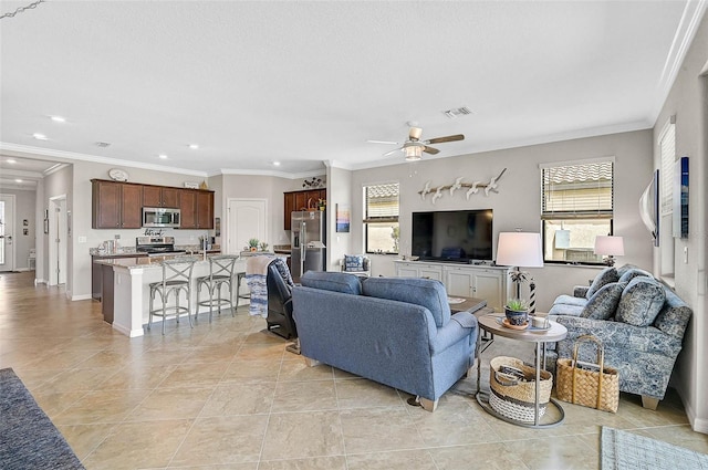 20542 Trattoria Loop, Venice, FL 34293 - living area featuring healthy amount of natural light, recessed lighting, ceiling fan, crown molding, and baseboards