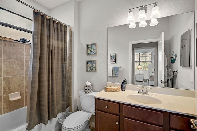20542 Trattoria Loop, Venice, FL 34293 - full bathroom with vanity, shower / bath combination with curtain, toilet, and a textured wall
