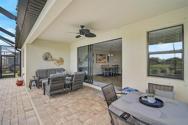 20542 Trattoria Loop, Venice, FL 34293 - view of patio featuring an outdoor living space, outdoor dining space, a ceiling fan, and a lanai