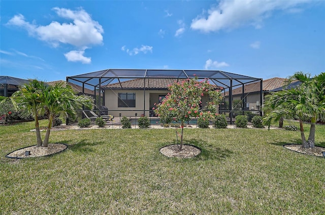 20542 Trattoria Loop, Venice, FL 34293 - rear view of property with a lawn and stucco siding