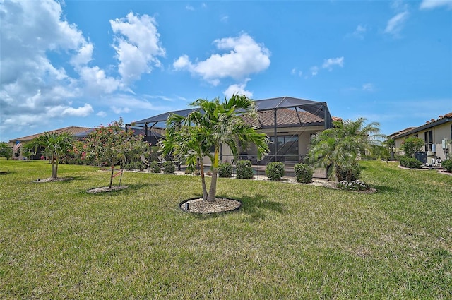 20542 Trattoria Loop, Venice, FL 34293 - back of property with a yard and glass enclosure