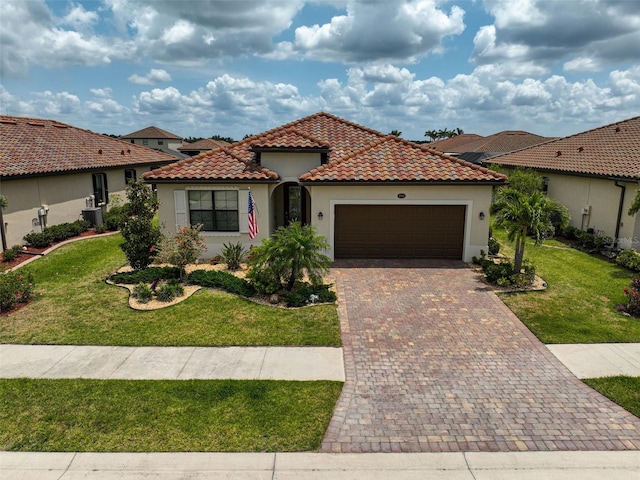 20542 Trattoria Loop, Venice, FL 34293 - mediterranean / spanish house with an attached garage, stucco siding, and a front lawn