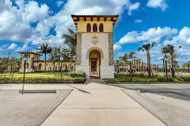 20542 Trattoria Loop, Venice, FL 34293 - entrance to property with stone siding and stucco siding