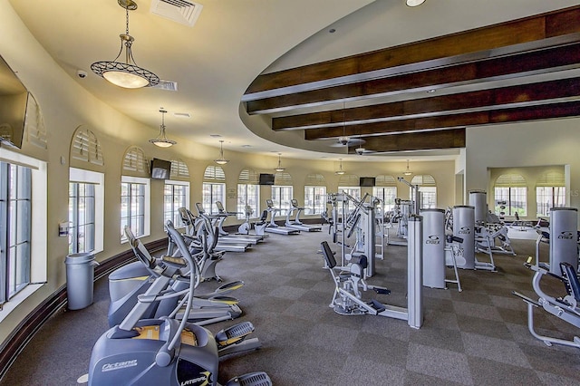 20542 Trattoria Loop, Venice, FL 34293 - workout area with beam ceiling and dark colored carpet