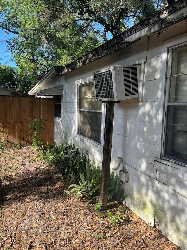 view of home's exterior with fence
