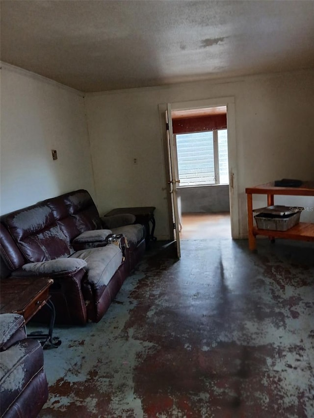 unfurnished living room featuring concrete floors