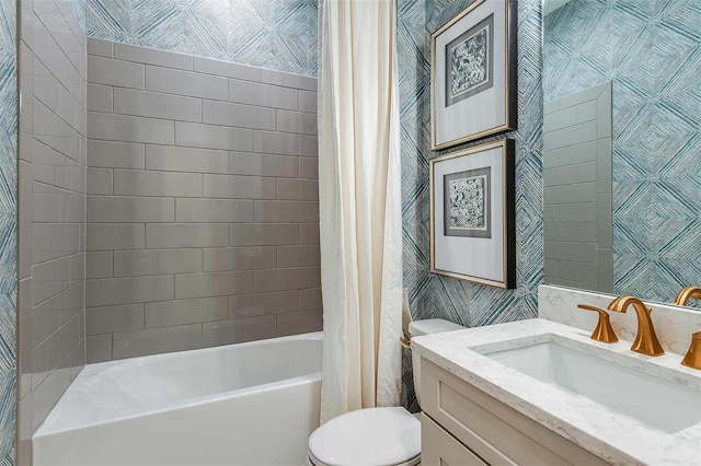 bathroom with toilet, shower / bath combo, and vanity