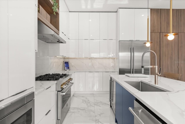 1521 Chestnut Ave, Winter Park, FL 32789 - kitchen featuring modern cabinets, built in appliances, decorative backsplash, and white cabinets