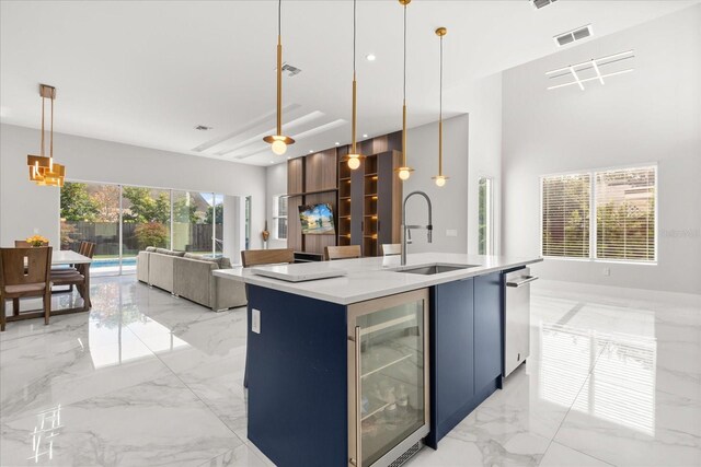 1521 Chestnut Ave, Winter Park, FL 32789 - kitchen with a sink, wine cooler, light marble finish floors, open floor plan, and light countertops