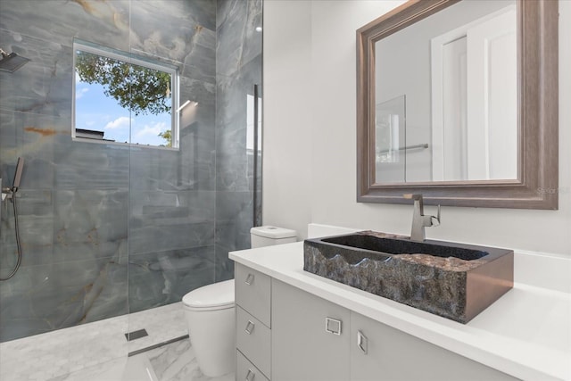 1521 Chestnut Ave, Winter Park, FL 32789 - bathroom with toilet, a stall shower, marble look tile flooring, and vanity