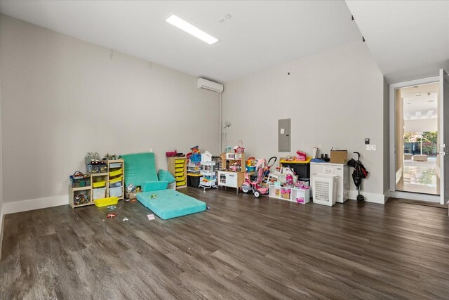 1521 Chestnut Ave, Winter Park, FL 32789 - playroom featuring wood finished floors, an AC wall unit, and electric panel